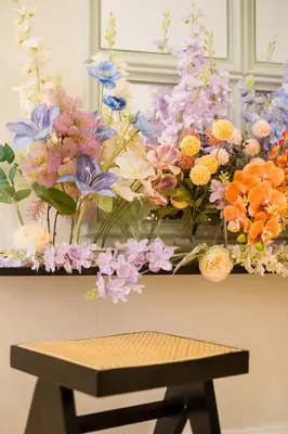 a bunch of flowers on a shelf with a bench at Bright 3BR Kids Café Home Slide LEGO Playroom in Kuala Lumpur
