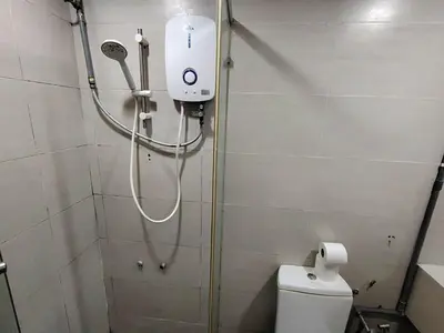 a shower in a bathroom with a toilet at Fahrenheit 88 Suites, Bukit Bintang 4R in Kuala Lumpur