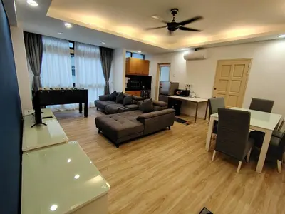 a living room with a couch and a piano at Fahrenheit 88 Suites, Bukit Bintang 4R in Kuala Lumpur