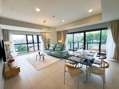 a living room with a couch and a table and chairs at The Atrium Jalan Ampang Elegant Fully Air-Con 3 BR Homestay in Kuala Lumpur