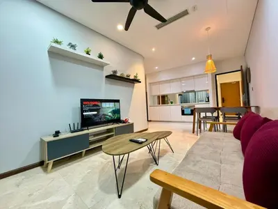a living room with a couch and a tv and a table at Apartment KL Luxury Home Stay in Kuala Lumpur