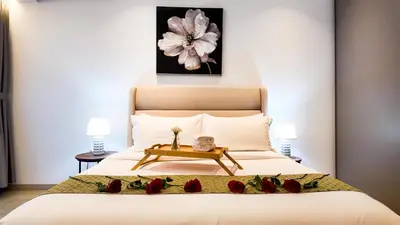 a bedroom with a bed with roses on it at Eaton Residence KLCC - Royal Home in Kuala Lumpur