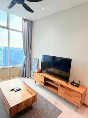 a living room with a large flat screen tv at Sky Suites KLCC by Apartment TD Luxury in Kuala Lumpur
