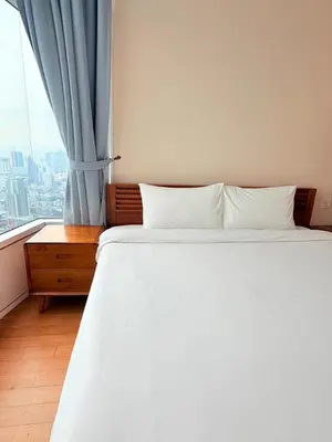 a bedroom with a white bed and a window at Sky Suites KLCC by Apartment TD Luxury in Kuala Lumpur