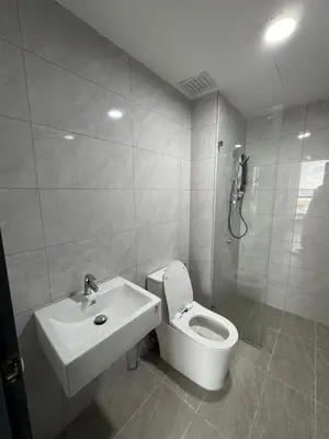 a bathroom with a toilet and a sink at star resdence in Kuala Lumpur