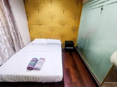 a room with a bed with two pillows on it at Cahaya Hanson BilikXpert in Kuala Lumpur