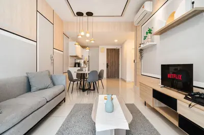 a living room with a couch and a tv at Continew Facing TRX View 10MIN TO KLCC With PS4 in Kuala Lumpur