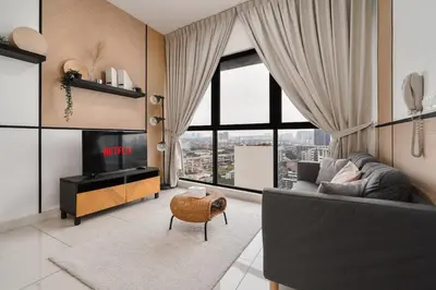 a living room with a couch and a large window at Continew Residence 10MIN To KLCC With Board Games Fit Up To 6PAX in Kuala Lumpur