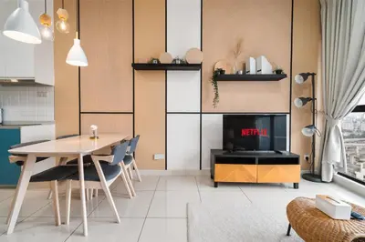 a living room with a table and a television at Continew Residence 10MIN To KLCC With Board Games Fit Up To 6PAX in Kuala Lumpur