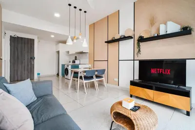a living room with a blue couch and a table at Continew Residence 10MIN To KLCC With Board Games Fit Up To 6PAX in Kuala Lumpur