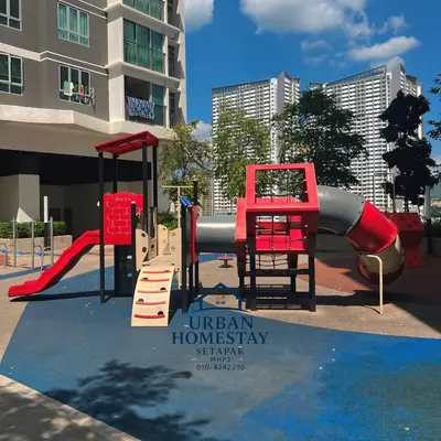 a playground with a slide in front of a building at Urban Homestay Setapak MHP2 Kids Friendly in Kuala Lumpur