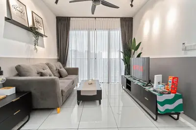 a living room with a couch and a tv at Kenwingston Platz 15 MINS TO KLCC Fit 5 Pax With Board games in Kuala Lumpur