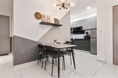 a kitchen and dining room with a table and chairs at Kenwingston Platz 15 MINS TO KLCC Fit 5 Pax With Board games in Kuala Lumpur