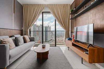a living room with a couch and a large window at Luxury 3Bedroom Kenwingston Platz 15Mins To KLCC Fit 9Pax A15 in Kuala Lumpur