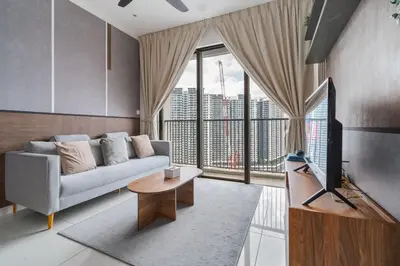 a living room with a couch and a large window at Luxury 3Bedroom Kenwingston Platz 15Mins To KLCC Fit 9Pax A15 in Kuala Lumpur