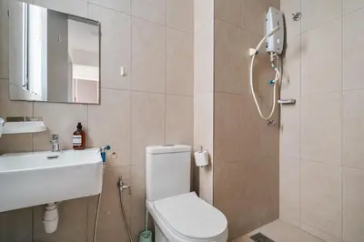 a bathroom with a toilet and a sink and a shower at Kenwingston Platz 15Mins To KLCC Fit 9Pax Modern Interior B25 in Kuala Lumpur