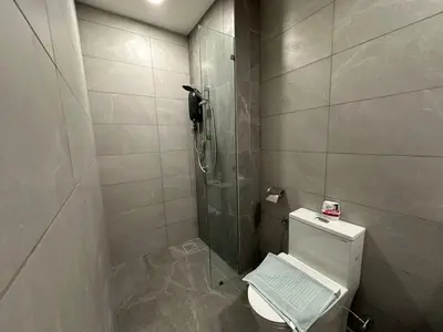 a small bathroom with a shower and a toilet at Majestic Residence KLCC By MYHOME in Kuala Lumpur