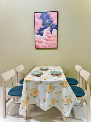 a dining room table with chairs and a painting on the wall at Majestic Residence KLCC By MYHOME in Kuala Lumpur