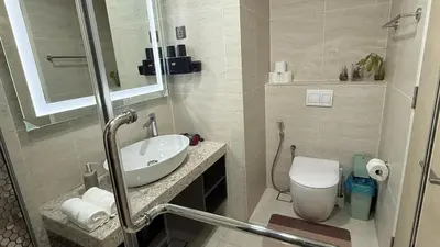 a bathroom with a sink and a toilet at Star Residance KLCC in Kuala Lumpur