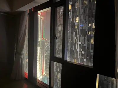 a window with a view of a city at Star Residance KLCC in Kuala Lumpur