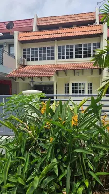 a building with a bush in front of it at Cozy Private Room in Taman Desa Shared Bathroom in Kuala Lumpur