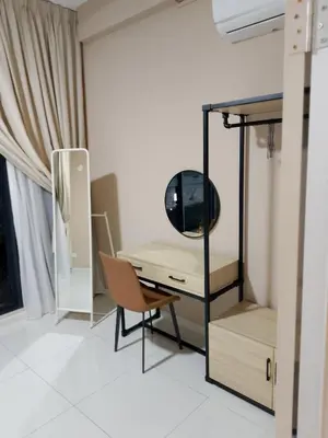 a room with a desk with a mirror and a chair at majestic residence klcc rooftop pool in Kuala Lumpur