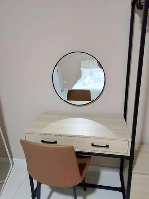 a mirror on top of a desk with a chair at majestic residence klcc rooftop pool in Kuala Lumpur