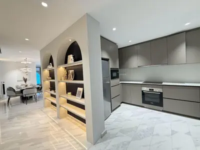 a kitchen with a dining room and a table at Twin Tower Crush by KF in Kuala Lumpur