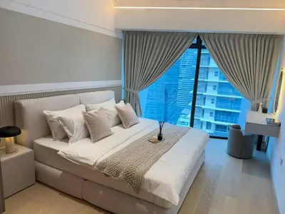a bedroom with a large bed with a large window at Twin Tower Crush by KF in Kuala Lumpur