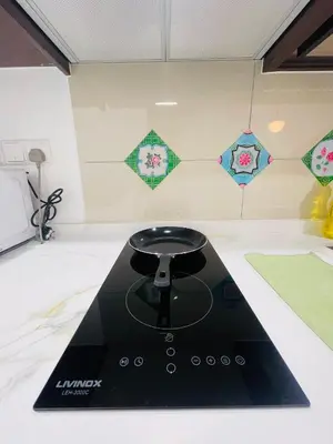 a kitchen with a black stove top in a room at Majestic Residence Kuala lumpur by Luxury in Kuala Lumpur