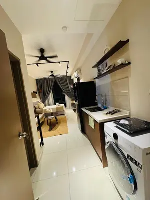 a kitchen with a stove and a counter top at Majestic Residence Kuala lumpur by Luxury in Kuala Lumpur
