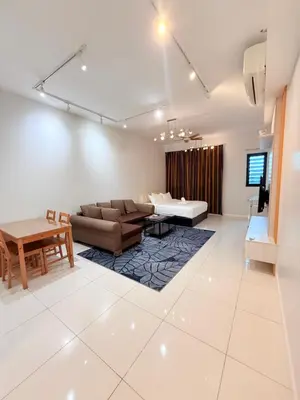 a living room with a couch and a table at Klcc Suites 1 By Chambers RMS in Kuala Lumpur