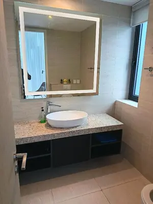 a bathroom with a sink and a large mirror at Rahmans Care At Star Residence KLCC in Kuala Lumpur