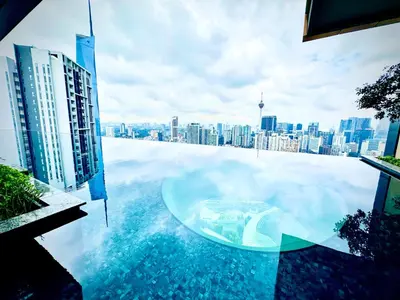 a glass table on top of a building with a city at Lucentia Residence At Bukit Bintang KLCC Pavilion in Kuala Lumpur