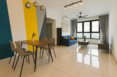 a living room with a table and chairs and a couch at M Vertica KLCC View IKEA Velocity in Kuala Lumpur