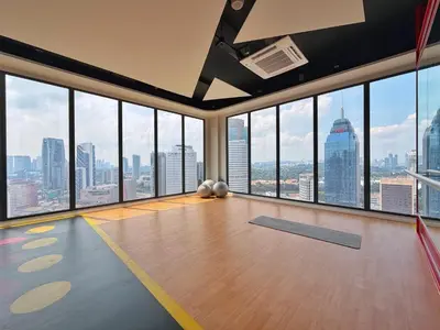 an empty room with a view of the city at KLCC View Majestic Cozy Studio with Rooftop Pool in Kuala Lumpur