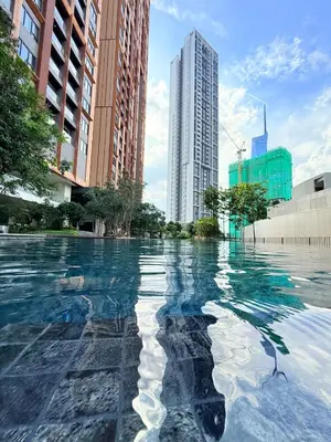 a pool of water in a city with tall buildings at Studio Apartment Lucentia Residence in Kuala Lumpur