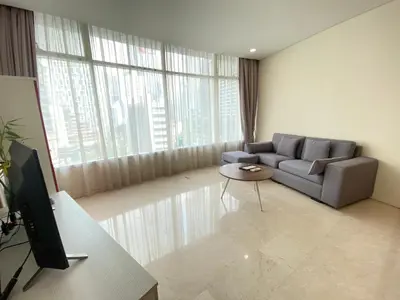 a living room with a couch and a table at Garden City of Lights Vortex Suites in Kuala Lumpur