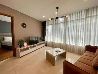 a living room with a couch and a television at Garden City of Lights Vortex Suites in Kuala Lumpur