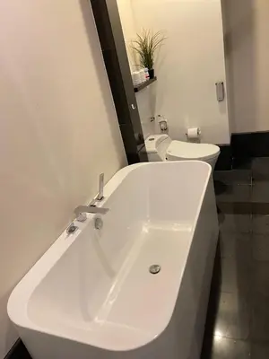 a bathroom with a white sink and a toilet at The Mews Klcc by Annie in Kuala Lumpur