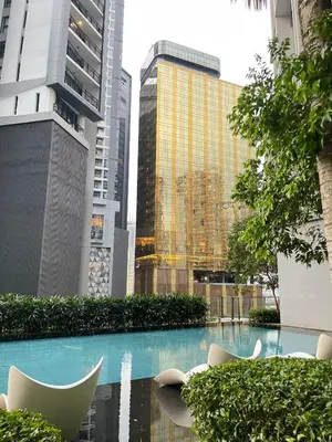 a pool in the middle of a city with buildings at The Mews Klcc by Annie in Kuala Lumpur