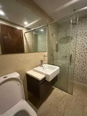 a bathroom with a toilet and a sink and a shower at regalia Panorama KLCC view in Kuala Lumpur