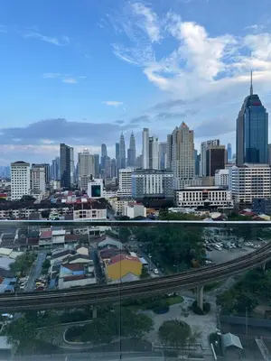 a view of a city with a highway and buildings at regalia Panorama KLCC view in Kuala Lumpur