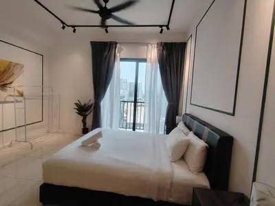 a bedroom with a large bed with a window at CHAMBERS RESIDENCE KLCC By DELUXE HOME in Kuala Lumpur