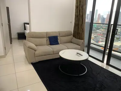 a living room with a couch and a table at Homestay at Trion Kuala Lumpur in Kuala Lumpur