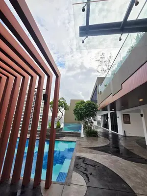 a pool in the middle of a building at KLCC View Pool & Gym 1 Bedroom Near LRT and Mall in Kuala Lumpur