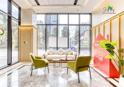 a lobby with a couch and chairs and a table at Agile Residence l 5 mins to TRX l Pavillion l Bukit Bintang l KLCC l Games Room l 4-7pax l City Centre by Jay Stay Management in Kuala Lumpur