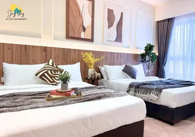 two beds in a hotel room with two beds at Agile Residence l 5 mins to TRX l Pavillion l Bukit Bintang l KLCC l Games Room l 4-7pax l City Centre by Jay Stay Management in Kuala Lumpur