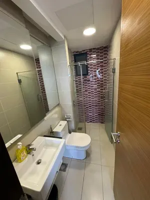 a bathroom with a sink and a toilet and a mirror at Casa Residency RH Homes in Kuala Lumpur