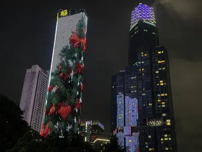a group of tall buildings lit up at night at 2min walk to TRX,KLCC view Gaming 2pax swimming pool in Kuala Lumpur
